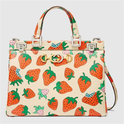 strawberry gucci bag|Gucci bag with strawberry charm.